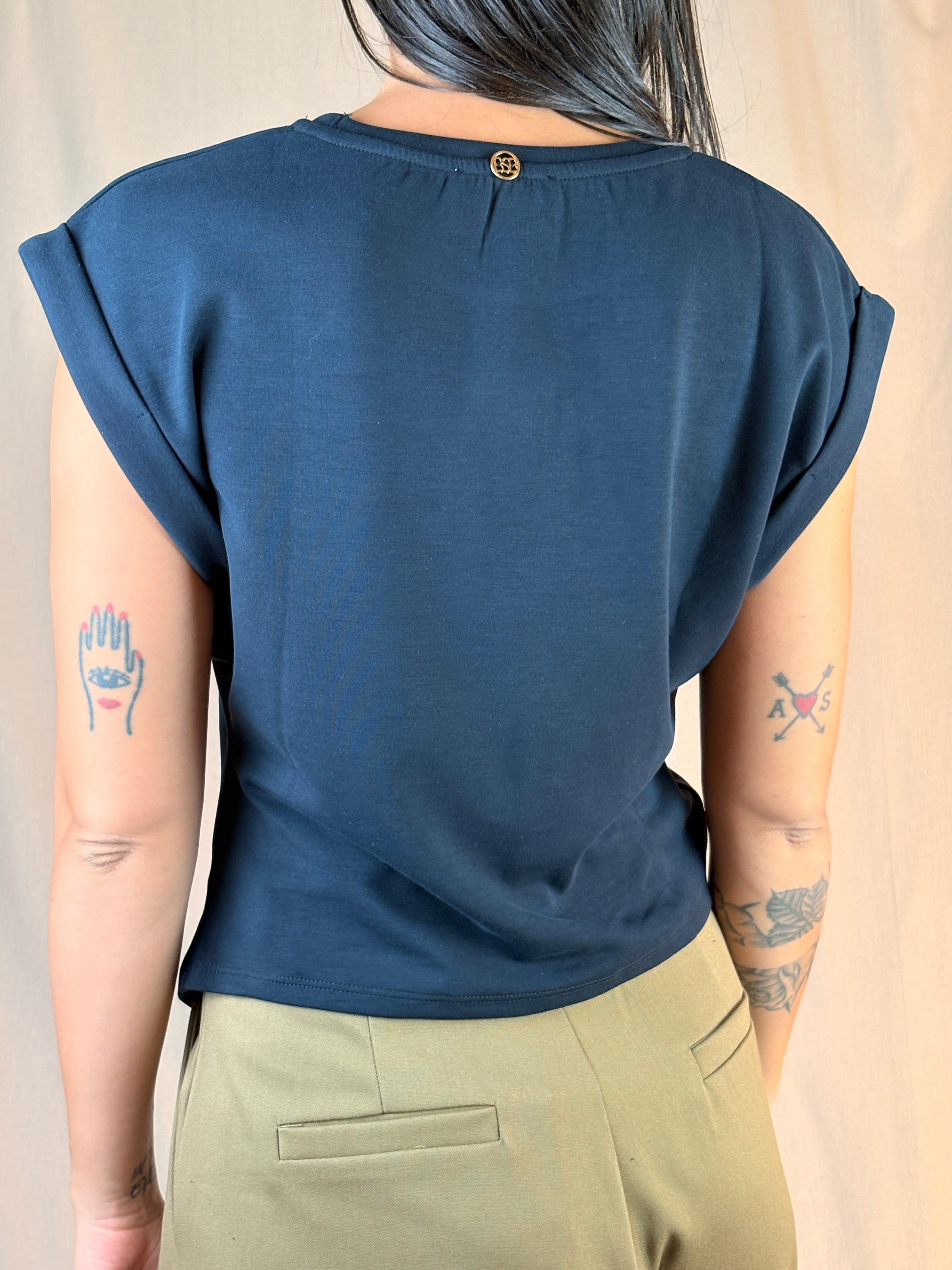 Maglia asimmetrica accessorio